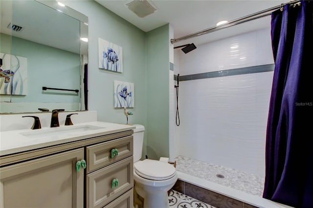 400 Island Way Unit 1709, Clearwater Beach, FL 33767 - bathroom featuring toilet, a tile shower, and vanity