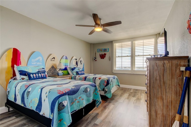 400 Island Way Unit 1709, Clearwater Beach, FL 33767 - bedroom with wood finished floors, baseboards, and a ceiling fan