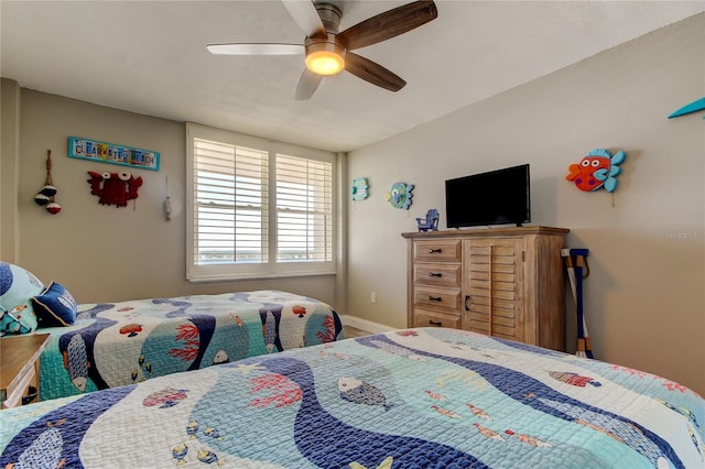 400 Island Way Unit 1709, Clearwater Beach, FL 33767 - bedroom featuring a ceiling fan and baseboards