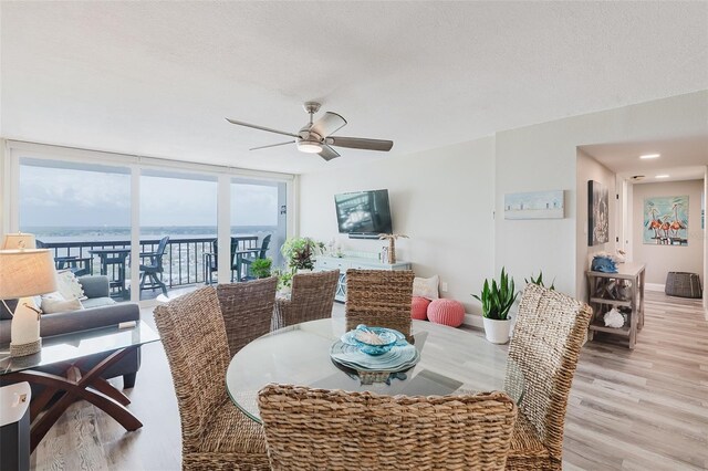 400 Island Way Unit 1709, Clearwater Beach, FL 33767 - dining space featuring ceiling fan and light wood-style flooring