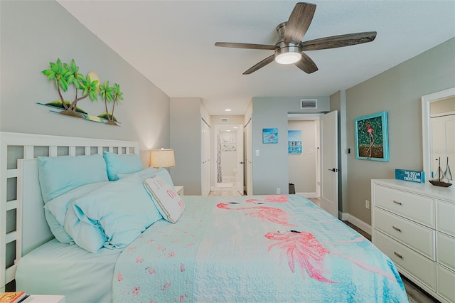 400 Island Way Unit 1709, Clearwater Beach, FL 33767 - bedroom featuring connected bathroom and a ceiling fan