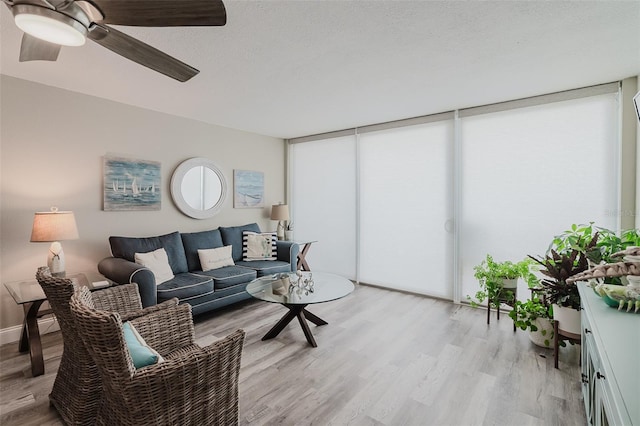 400 Island Way Unit 1709, Clearwater Beach, FL 33767 - living room with light wood finished floors and a ceiling fan