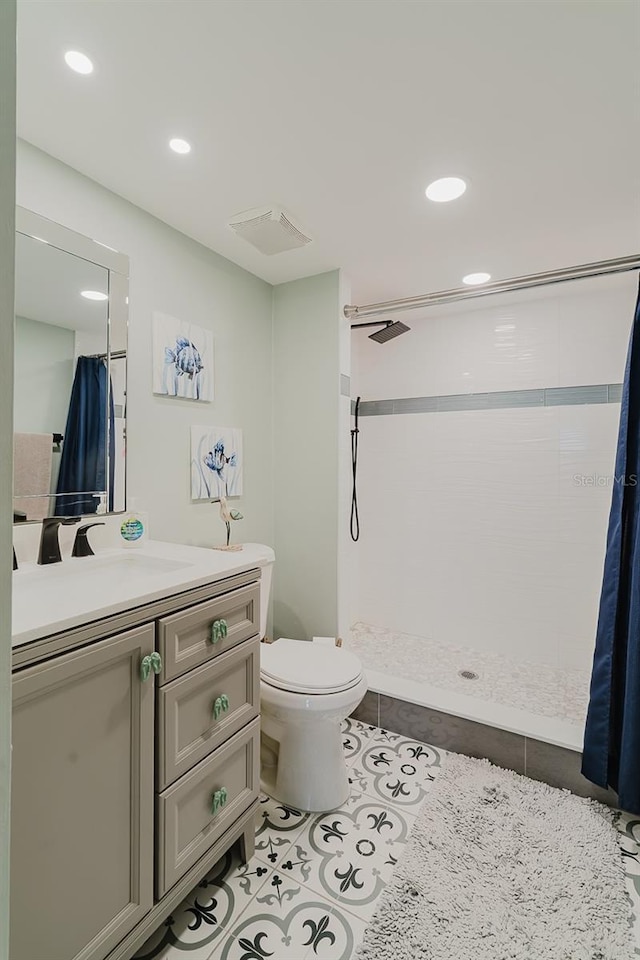 400 Island Way Unit 1709, Clearwater Beach, FL 33767 - full bathroom featuring vanity, tiled shower, tile patterned flooring, and recessed lighting