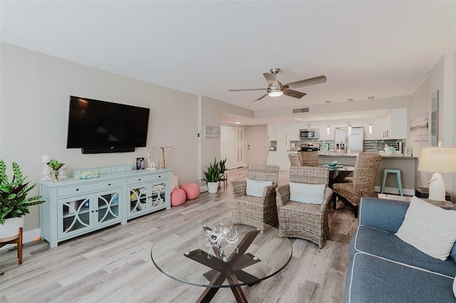 400 Island Way Unit 1709, Clearwater Beach, FL 33767 - living room with a ceiling fan and light wood finished floors