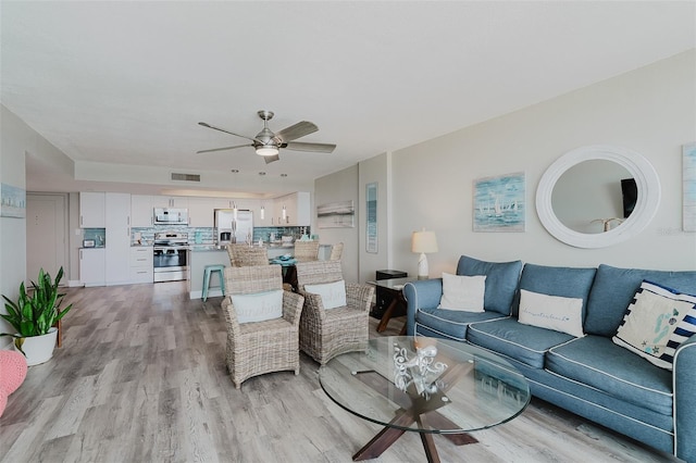 400 Island Way Unit 1709, Clearwater Beach, FL 33767 - living room featuring light wood-type flooring and ceiling fan