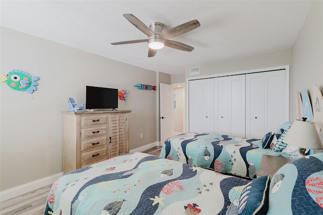 400 Island Way Unit 1709, Clearwater Beach, FL 33767 - bedroom with wood finished floors, a closet, and a ceiling fan