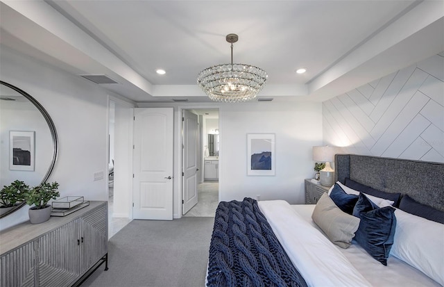 carpeted bedroom with a chandelier, a raised ceiling, and recessed lighting