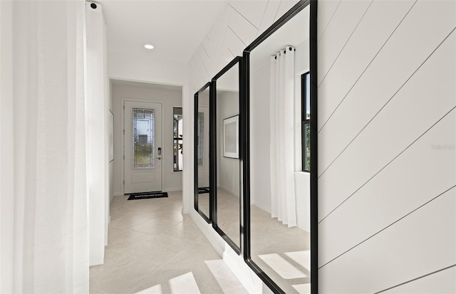 corridor featuring light tile patterned flooring and recessed lighting