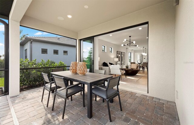 dining area featuring recessed lighting and a chandelier