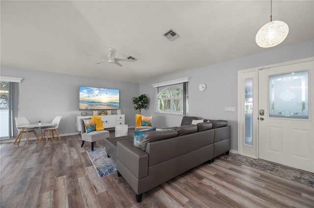 5193 Boyle Ter, Port Charlotte, FL 33981 - living area with wood finished floors, plenty of natural light, ceiling fan, and baseboards