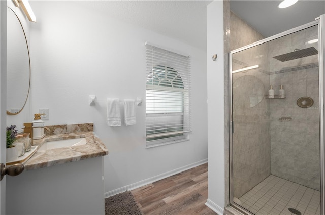 5193 Boyle Ter, Port Charlotte, FL 33981 - full bath with a stall shower, vanity, wood finished floors, and baseboards