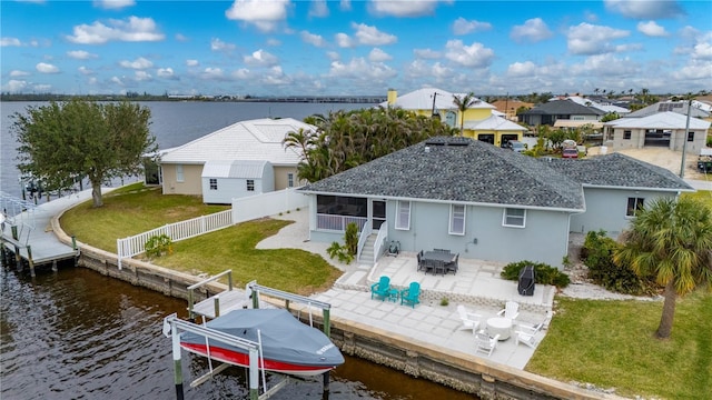 5193 Boyle Ter, Port Charlotte, FL 33981 - back of property with a water view, a patio, boat lift, and stucco siding