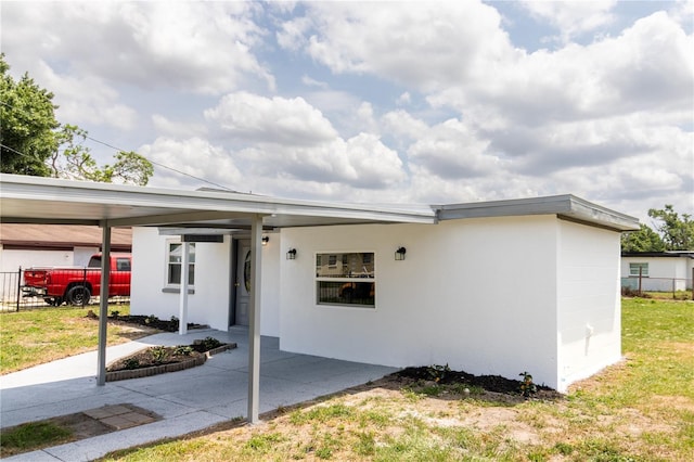5210 S 80th St, Tampa, FL 33619 - single story home featuring fence, a carport, and stucco siding