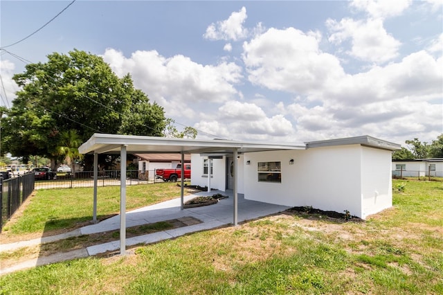 5210 S 80th St, Tampa, FL 33619 - view of front of home featuring stucco siding and an attached carport