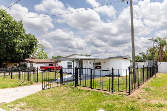 5210 S 80th St, Tampa, FL 33619 - view of front of property featuring stucco siding, a gate, and concrete driveway