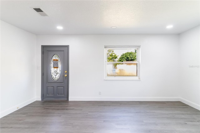 5210 S 80th St, Tampa, FL 33619 - entryway with wood finished floors, recessed lighting, and baseboards