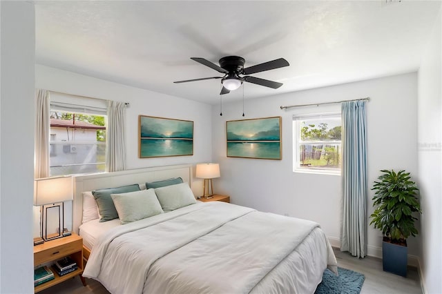 5210 S 80th St, Tampa, FL 33619 - bedroom featuring wood finished floors, a ceiling fan, and baseboards