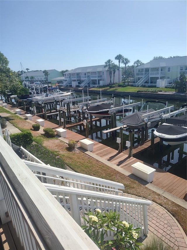 view of dock with boat lift and a water view