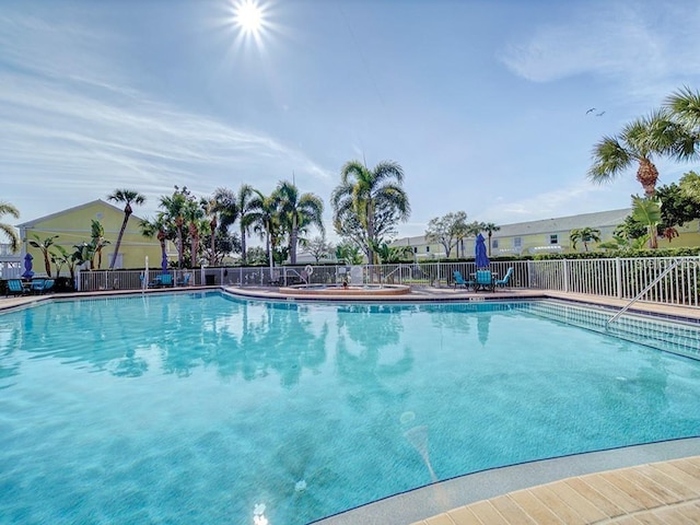 community pool featuring fence
