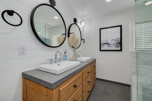 315 Ridge Rd, Palm Harbor, FL 34683 - full bath with double vanity, tile patterned flooring, baseboards, and recessed lighting