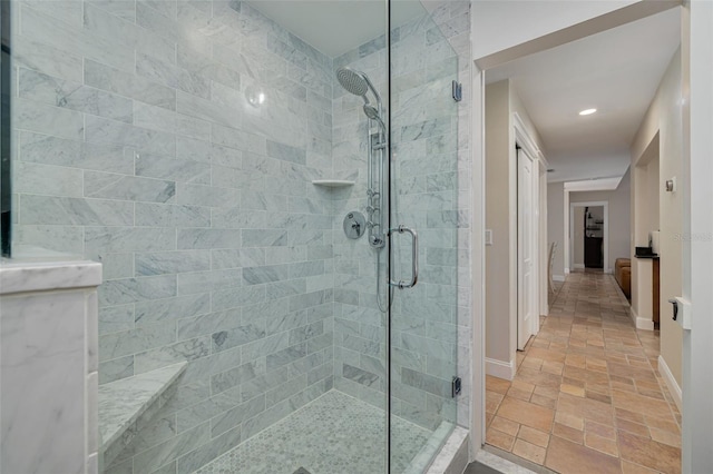 315 Ridge Rd, Palm Harbor, FL 34683 - full bath with a shower stall, baseboards, stone tile floors, and recessed lighting
