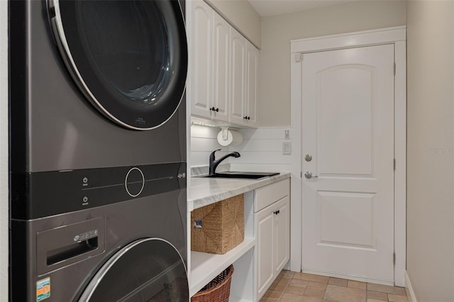 315 Ridge Rd, Palm Harbor, FL 34683 - washroom featuring cabinet space and stacked washer / dryer