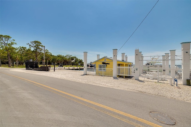 315 Ridge Rd, Palm Harbor, FL 34683 - view of asphalt road featuring a gate