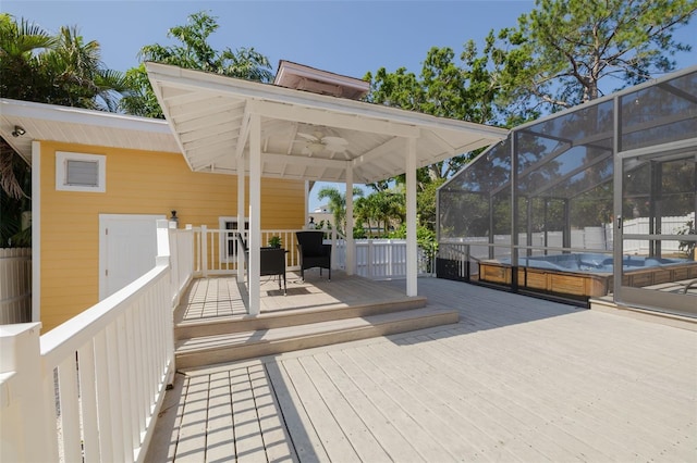 315 Ridge Rd, Palm Harbor, FL 34683 - wooden deck featuring a ceiling fan, glass enclosure, and a swimming pool