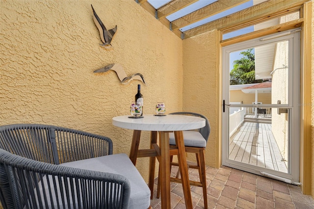 315 Ridge Rd, Palm Harbor, FL 34683 - dining space with a textured wall and brick flooring