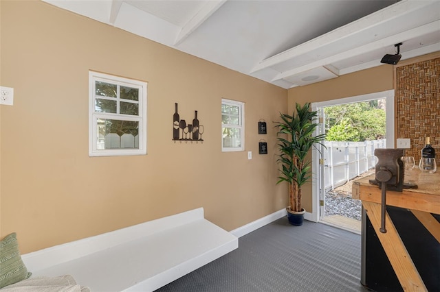 315 Ridge Rd, Palm Harbor, FL 34683 - hallway with baseboards and dark colored carpet