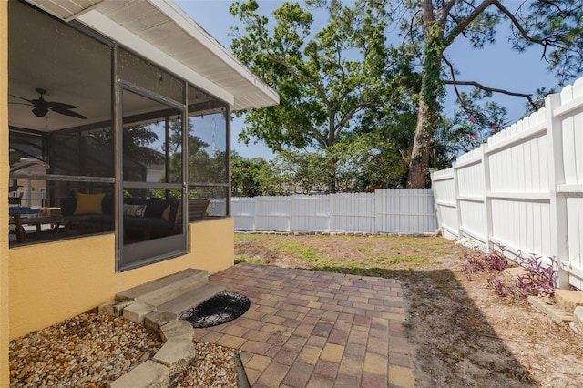 315 Ridge Rd, Palm Harbor, FL 34683 - fenced backyard featuring a sunroom, a patio area, entry steps, and ceiling fan