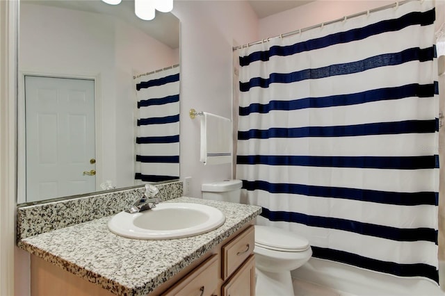 bathroom with toilet, vanity, and a shower with curtain