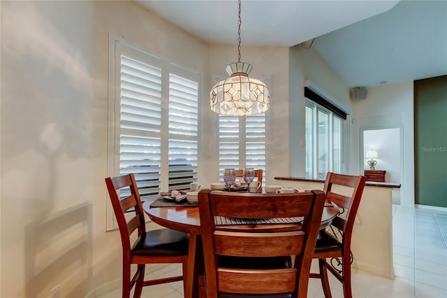 dining room featuring tile patterned floors and baseboards
