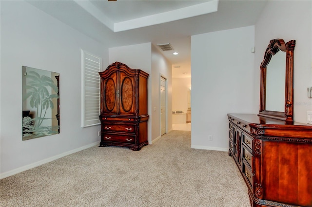 bedroom with light carpet, ensuite bath, baseboards, and recessed lighting