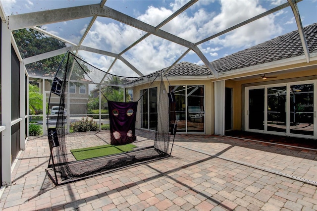 view of patio / terrace featuring a lanai