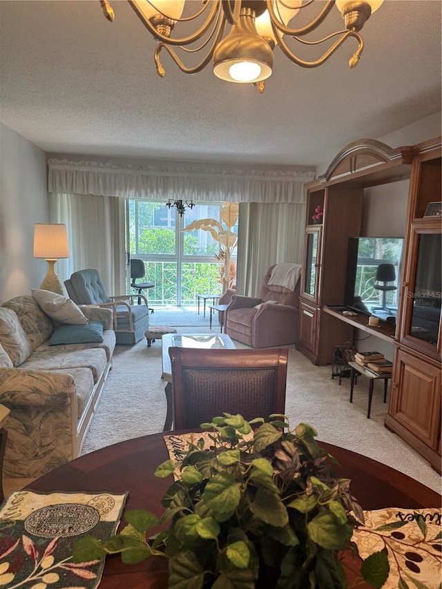 living area featuring carpet, a textured ceiling, and a chandelier