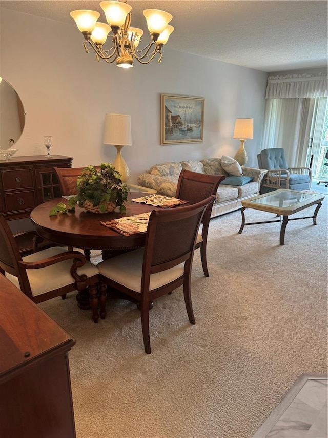 dining space featuring light carpet and an inviting chandelier