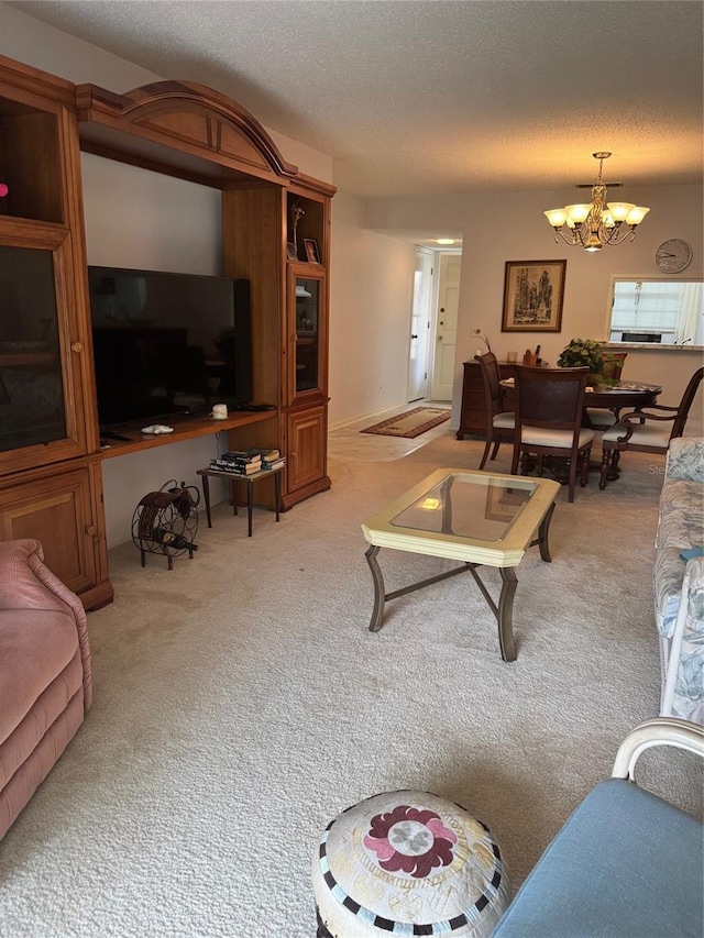 carpeted living room with an inviting chandelier and a textured ceiling