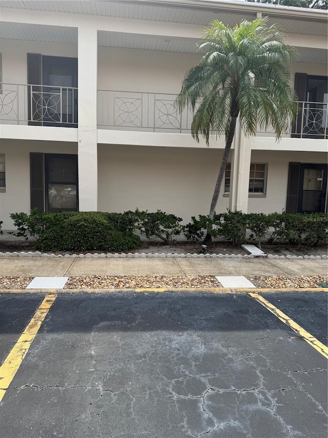 view of property with uncovered parking