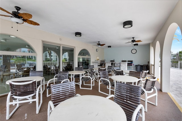 view of patio with ceiling fan and outdoor dining area
