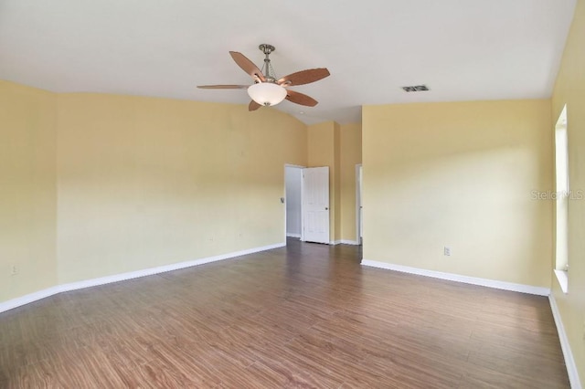 27012 Sea Breeze Way, Wesley Chapel, FL 33544 - empty room featuring ceiling fan, dark wood-style floors, lofted ceiling, and baseboards
