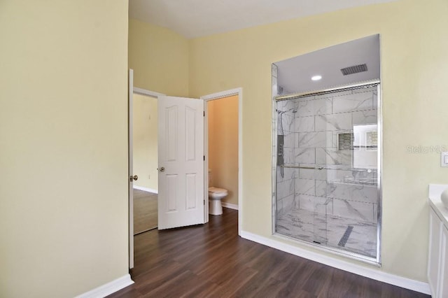 27012 Sea Breeze Way, Wesley Chapel, FL 33544 - full bath featuring toilet, a marble finish shower, wood finished floors, baseboards, and vanity