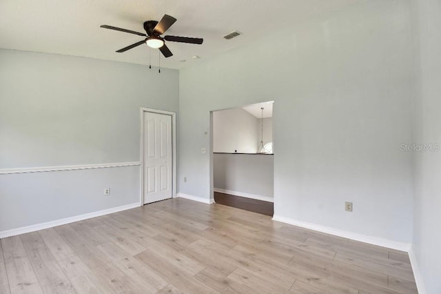 27012 Sea Breeze Way, Wesley Chapel, FL 33544 - empty room with a ceiling fan, wood finished floors, and baseboards
