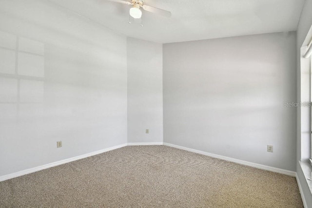 27012 Sea Breeze Way, Wesley Chapel, FL 33544 - carpeted empty room with a ceiling fan and baseboards