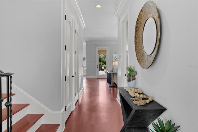 hall featuring dark wood finished floors, crown molding, recessed lighting, and baseboards