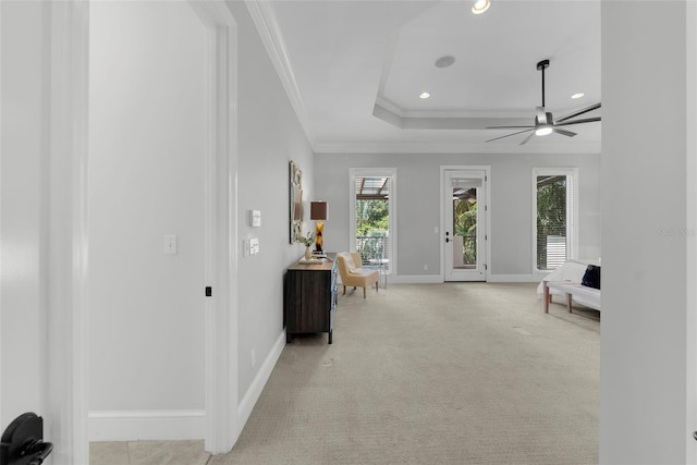 living area featuring crown molding, a ceiling fan, baseboards, recessed lighting, and a tray ceiling