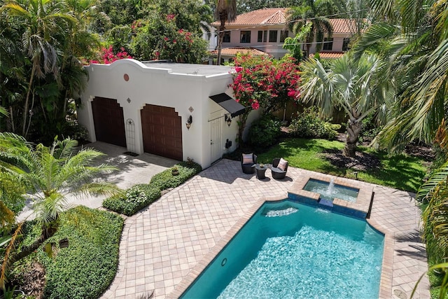 view of pool featuring a pool with connected hot tub