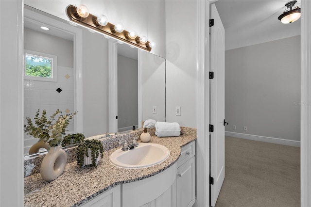 bathroom featuring vanity and baseboards