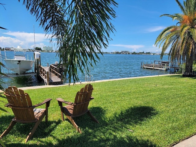 7092 S Shore Dr S, Saint Petersburg, FL 33707 - dock area featuring a lawn, boat lift, and a water view