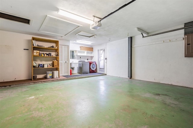 7092 S Shore Dr S, Saint Petersburg, FL 33707 - garage with a garage door opener and washing machine and clothes dryer